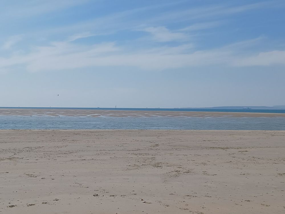 East Winner sandbank viewed from Hayling Island, with the Isle of Wight on the horizon. Hayling Island, Hampshire, England.