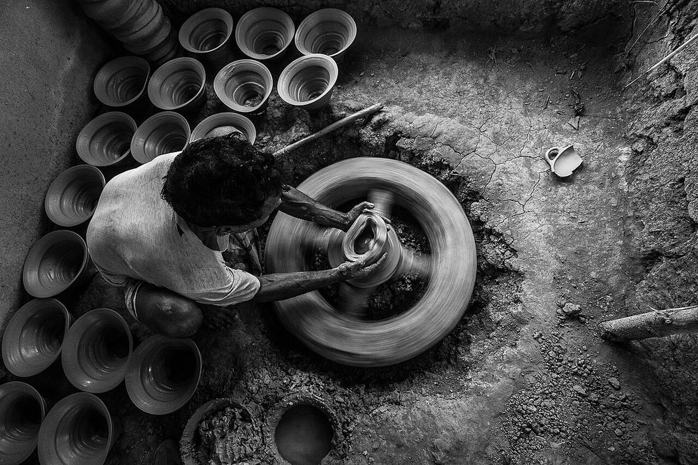 Pottery maker doing his work. Banshkhali, a village a few kilometres from Chittagong town, Bangladesh. For decades locals there have pursued a pottery tradition, crafting all manner of wares from raw clay to fire in the kilns.