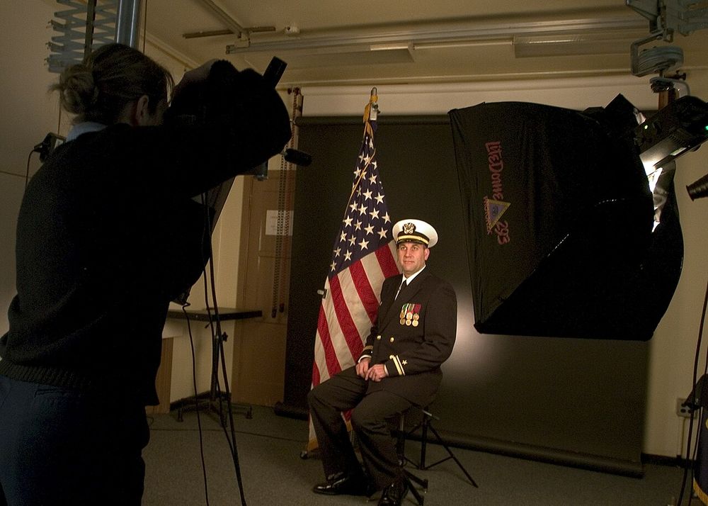 Whidbey Island, Wash. (Feb. 15, 2005) - Photographer's Mate 2nd Class Casey R. Jones of San Angelo, Texas, prepares to photograph a studio portrait at the Photo Lab on board Naval Station Whidbey Island, Wash. Photographer's Mates are scheduled to merge with Journalist's, Lithographer's and Draftsma
